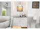 Charming wet bar area features granite counters, white cabinets, and stylish lighting at 1116 Daffodil Ln, Mount Pleasant, SC 29464