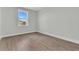 Bedroom featuring hardwood floors, a window, and light neutral-colored walls at 1159 Reserve Ln, Awendaw, SC 29429