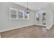 Bright dining room featuring hardwood floors, large windows, and sliding glass doors at 1159 Reserve Ln, Awendaw, SC 29429