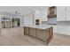 Modern kitchen featuring white cabinets, a large island, stainless steel appliances and bright natural light at 1159 Reserve Ln, Awendaw, SC 29429