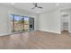 Spacious living room featuring hardwood floors, sliding glass doors, and a fireplace at 1159 Reserve Ln, Awendaw, SC 29429