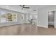 Open loft space with hardwood floors, a ceiling fan, and plenty of natural light at 1159 Reserve Ln, Awendaw, SC 29429