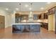 Modern kitchen features a brick backsplash, dark cabinetry, large island and modern stainless steel appliances at 1212 Reserve Ln, Awendaw, SC 29429