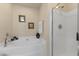 Bathroom with shower, soaking tub, and framed art pieces at 1216 Wild Goose Trl, Summerville, SC 29483