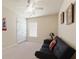 Cozy bedroom with neutral carpet, ceiling fan, natural light, and a comfortable futon sofa at 1216 Wild Goose Trl, Summerville, SC 29483