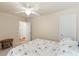 Well-lit bedroom with natural light, ceiling fan, plush carpet, and a queen-sized bed at 1216 Wild Goose Trl, Summerville, SC 29483