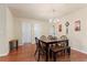 Bright dining area with chandelier, hardwood floors, table, bench and decorative wall hangings at 1216 Wild Goose Trl, Summerville, SC 29483