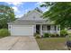 Charming home featuring a two-car garage, well-maintained lawn and attractive curb appeal at 1216 Wild Goose Trl, Summerville, SC 29483