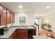 Well-maintained kitchen with granite countertops, stainless appliances, and cherry wood cabinetry at 1216 Wild Goose Trl, Summerville, SC 29483