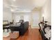 Inviting living room with hardwood floors, ceiling fan, and abundant natural light at 1216 Wild Goose Trl, Summerville, SC 29483