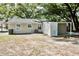 The home features a spacious backyard with a storage area, concrete area, and large shady trees at 1232 Hawthorne Cir, Hanahan, SC 29410