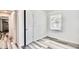 Bright bedroom featuring a door and a large window with hardwood floors and a neutral color at 1232 Hawthorne Cir, Hanahan, SC 29410
