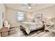 Comfortable bedroom with a ceiling fan, stylish decor, and a full sized bed in a cozy living space at 1232 Hawthorne Cir, Hanahan, SC 29410
