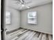 Bright, clean bedroom with ceiling fan and hardwood floors with natural light at 1232 Hawthorne Cir, Hanahan, SC 29410