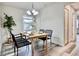 Charming dining room featuring a wooden table, stylish black chairs, and a decorative chandelier at 1232 Hawthorne Cir, Hanahan, SC 29410