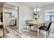 Charming dining room adjacent to kitchen with modern appliances at 1232 Hawthorne Cir, Hanahan, SC 29410