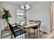 Charming dining room featuring a wooden table, stylish black chairs, and a decorative chandelier at 1232 Hawthorne Cir, Hanahan, SC 29410