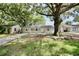 Charming single-story home featuring a welcoming front porch, spacious yard, and mature shade trees at 1232 Hawthorne Cir, Hanahan, SC 29410