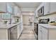 Modern kitchen with sleek stainless steel appliances and quartz countertops at 1232 Hawthorne Cir, Hanahan, SC 29410