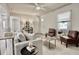 Open living space showcasing stylish furniture, wood-look floors, and abundant natural light at 1232 Hawthorne Cir, Hanahan, SC 29410