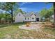 Wide backyard featuring a fire pit and ample space for outdoor activities at 1260 Old Whitesville Rd, Moncks Corner, SC 29461