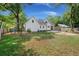 Expansive backyard featuring a swing set, patio, and fire pit, perfect for outdoor enjoyment and entertaining at 1260 Old Whitesville Rd, Moncks Corner, SC 29461