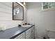Charming bathroom with wainscoting, vanity, and a framed mirror above the sink at 1260 Old Whitesville Rd, Moncks Corner, SC 29461