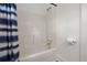 Clean bathroom with a blue-and-white shower curtain, a shower with sleek fixtures, and built-in shelving at 1260 Old Whitesville Rd, Moncks Corner, SC 29461