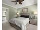 Comfortable bedroom with ceiling fan, neutral tones, and en suite bathroom at 1260 Old Whitesville Rd, Moncks Corner, SC 29461