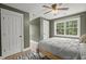 Bright bedroom with a ceiling fan, multiple windows, and two closets at 1260 Old Whitesville Rd, Moncks Corner, SC 29461