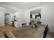 Open dining room featuring a wooden table, seating, and views into the living room and kitchen at 1260 Old Whitesville Rd, Moncks Corner, SC 29461