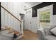 Inviting foyer with hardwood floors, staircase, and natural light at 1260 Old Whitesville Rd, Moncks Corner, SC 29461