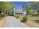 Inviting home with a classic design, featuring a well-manicured front yard and a gravel driveway at 1260 Old Whitesville Rd, Moncks Corner, SC 29461