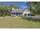 Charming two-story home featuring a welcoming front porch and well-maintained landscaping at 1260 Old Whitesville Rd, Moncks Corner, SC 29461