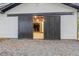Garage with sliding black doors, offering ample space and easy access for vehicles and storage at 1260 Old Whitesville Rd, Moncks Corner, SC 29461