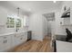 Bright kitchen featuring white cabinets, stainless steel appliances, and hardwood floors at 1260 Old Whitesville Rd, Moncks Corner, SC 29461