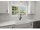 Charming kitchen features a farmhouse sink, granite countertops, and stainless steel appliances at 1260 Old Whitesville Rd, Moncks Corner, SC 29461