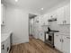 Bright kitchen with white cabinets and stainless steel appliances at 1260 Old Whitesville Rd, Moncks Corner, SC 29461