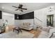 Bright living room with hardwood floors, comfortable seating, and staircase at 1260 Old Whitesville Rd, Moncks Corner, SC 29461