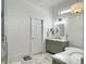 Bright bathroom with shiplap walls, marble tile, and elegant fixtures at 127 Beresford Creek St, Daniel Island, SC 29492