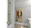 Bright bathroom featuring tiled shower and a marble vanity at 127 Beresford Creek St, Daniel Island, SC 29492