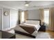 Bedroom with a ceiling fan, windows with coverings, and hardwood floors at 127 Beresford Creek St, Daniel Island, SC 29492