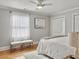 Serene bedroom featuring a ceiling fan, natural light, and a cozy rug on hardwood floors at 127 Beresford Creek St, Daniel Island, SC 29492