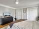 Neutral bedroom with a ceiling fan, two closets, and hardwood floors at 127 Beresford Creek St, Daniel Island, SC 29492