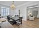 Elegant dining room featuring a chandelier, hardwood floors, and modern decor at 127 Beresford Creek St, Daniel Island, SC 29492