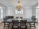 Dining room with a chandelier, hardwood floors, and seating for eight at 127 Beresford Creek St, Daniel Island, SC 29492