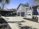 Exterior view of a blue house with a two car garage and a carport at 127 Beresford Creek St, Daniel Island, SC 29492
