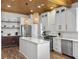 Beautiful kitchen with white cabinets, stainless steel appliances, and a wooden ceiling at 127 Beresford Creek St, Daniel Island, SC 29492