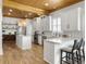 Spacious kitchen with white cabinets, stainless steel appliances, and a center island at 127 Beresford Creek St, Daniel Island, SC 29492
