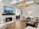 Cozy living room featuring a fireplace, modern decor, and an inviting atmosphere at 127 Beresford Creek St, Daniel Island, SC 29492